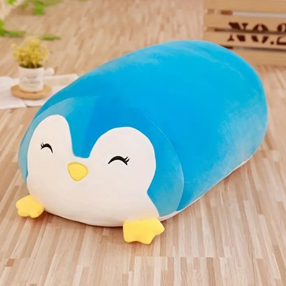 Penguin stuffed animal. New. 10” x 6”. Stretchy nylon material. Squishy. Blue